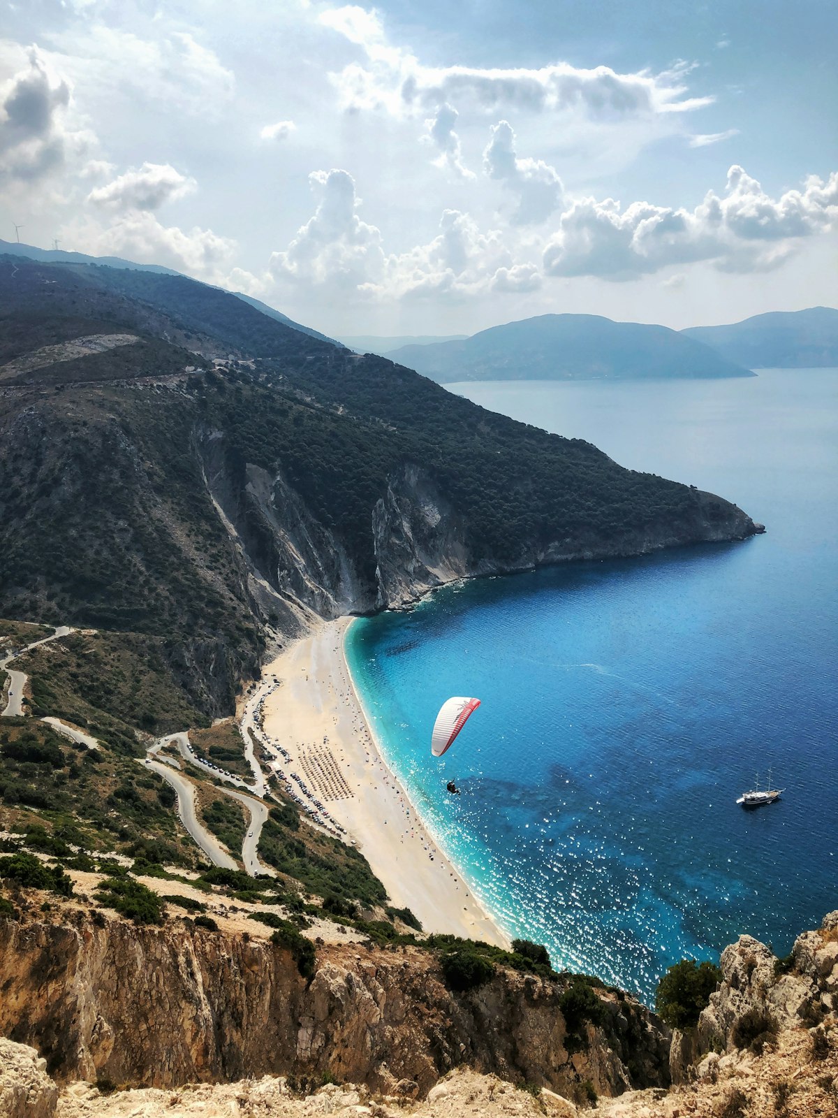 Green hills above turquoise water in Kefalonia, Ionian Islands