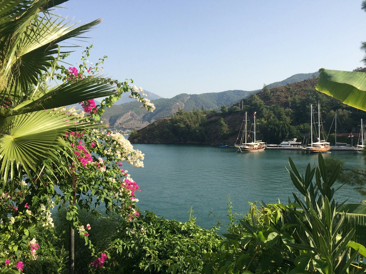 Boat in a mountain-lined bay near Fethiye, Turkey